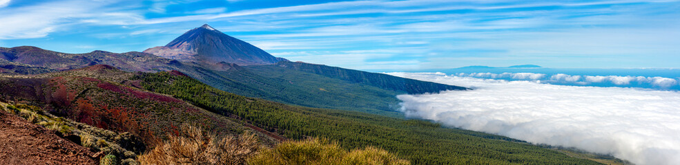 Panoramic view of the Teide National Park with the sea of ​​clouds and La Palma island in the background. Tenerife. Canary Islands. © linohoracio