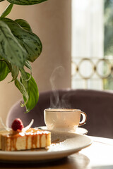 airy dessert decorated with raspberries, served with tea, dessert in the interior