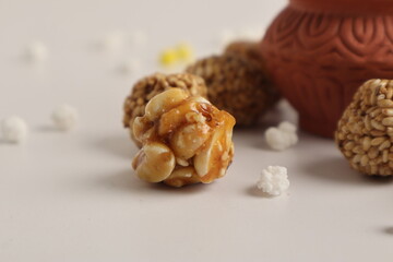 Indian festival makar sankranti concept, Sesame seed ball or til ke laddo with Kite String