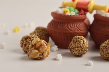 Indian festival makar sankranti concept : Tilgul in small bowl. Tilgul is a colourful sesame candy coated with sesame seeds; in Maharashtra people exchange tilgul on Sankranti
