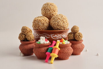 Til Gul OR Sweet Sesame seed ball or Laddu with Fikri for Indian festival Makar Sankranti over...