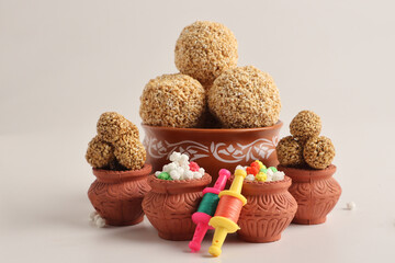Til Gul OR Sweet Sesame seed ball or Laddu with Fikri for Indian festival Makar Sankranti over...