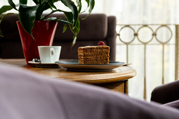 dessert decorated with raspberries, served with coffee. Photo of dessert in the interior
