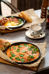 breakfast of omelet, eggs fried with bacon. Served with fresh pastries and drinks