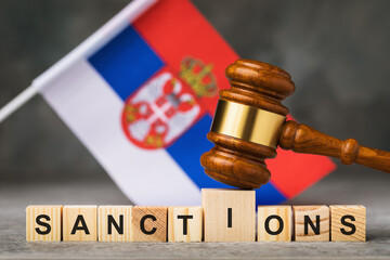 Judge gavel, wooden cubes with the text on the background of the Serbian flag, the concept on the...