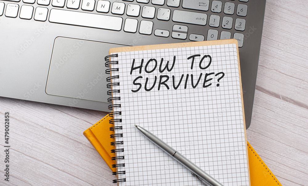 Poster how to survive text written on a notebook on the laptop
