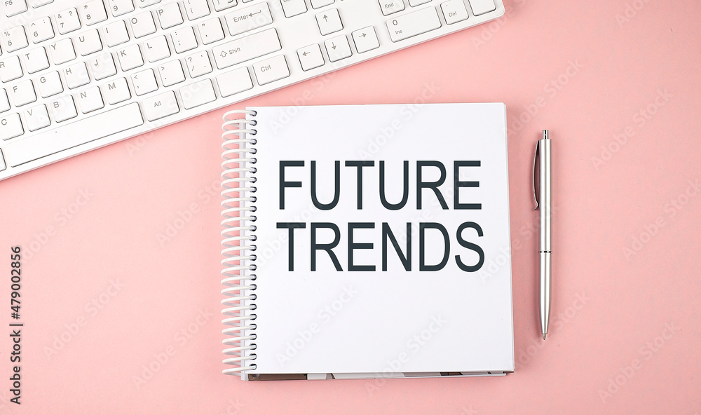 Poster pink office desk with keyboard and notebook with text future trends