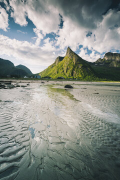 Empty sand beach with majestic Hatten mountain in the background, Ersfjord, Senja island, Troms county, Norway, Scandinavia