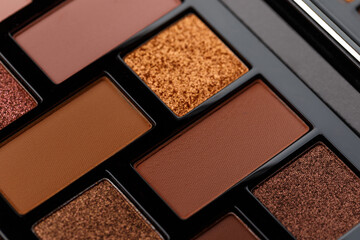 A palette of makeup shadows as an abstract background. MUA and girly concept. Luxury Eyeshadow palette, cosmetics product as luxury beauty brand promotion. Contouring makeup palette close up