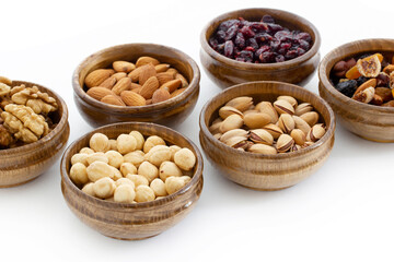 dried fruit and various nuts on plates