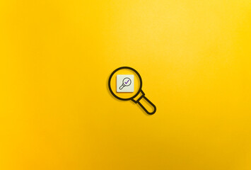Double Checking Concept. Magnifying Glass Symbol on Yellow Background. 