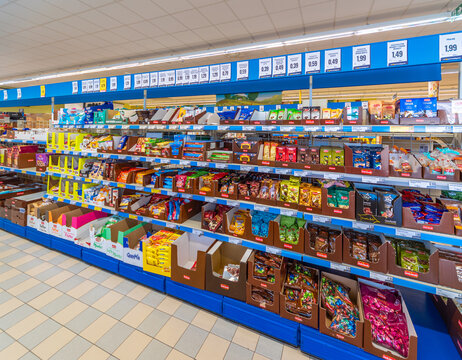 Fossano, Italy - October 29, 2021: shelves, for the sale of sweets, chocolate, snacks, candies, inside Eurospin discount supermarket. It is an Italian company distribution of the discount channel