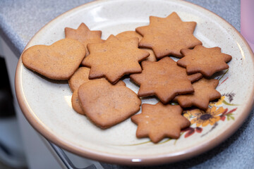 Gingerbread cookies in the home kitchen. Sweet yulyuda close-up.