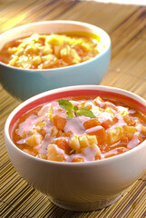 Fruit salad served in bowl with sour cream