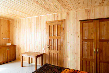 Wooden wall  and doors motel casual room apartment interior simple minimalistic decoration