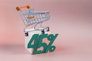 An empty metal basket from the store on a light podium and the figure 45% on a red background...