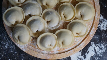 dumplings, a traditional dish of Russian cuisine, made of dough stuffed with minced meat, minced meat, cooking process, modeling, recipe