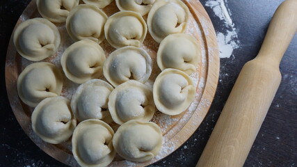 dumplings, a traditional dish of Russian cuisine, made of dough stuffed with minced meat, minced meat, cooking process, modeling, recipe