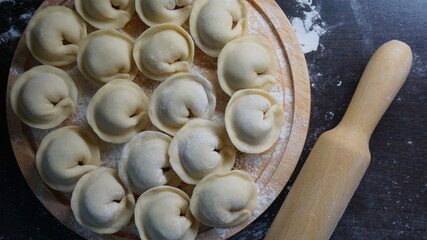 dumplings, a traditional dish of Russian cuisine, made of dough stuffed with minced meat, minced meat, cooking process, modeling, recipe