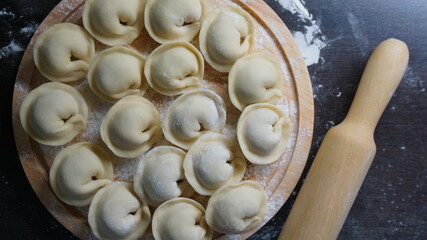 dumplings, a traditional dish of Russian cuisine, made of dough stuffed with minced meat, minced meat, cooking process, modeling, recipe