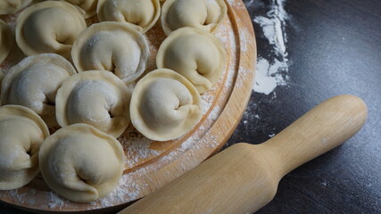 dumplings, a traditional dish of Russian cuisine, made of dough stuffed with minced meat, minced meat, cooking process, modeling, recipe