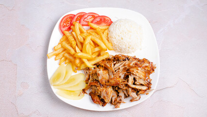 Portion pilaf chicken doner kebab with french fries isolated