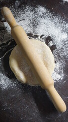 cooking process, modeling, recipe, dough, roll out with a wooden rolling pin, flour