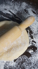 cooking process, modeling, recipe, dough, roll out with a wooden rolling pin, flour