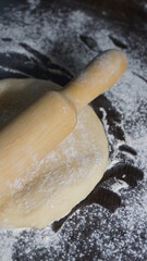 cooking process, modeling, recipe, dough, roll out with a wooden rolling pin, flour