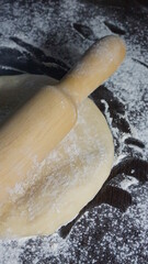 cooking process, modeling, recipe, dough, roll out with a wooden rolling pin, flour