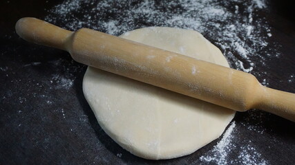 cooking process, modeling, recipe, dough, roll out with a wooden rolling pin, flour