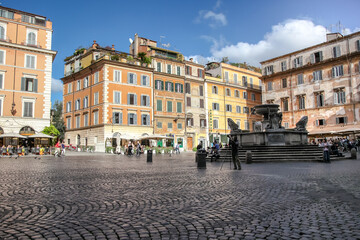 Fototapeta na wymiar Santa Maria in Trastevere Square in Rome. Sunny autumn day.