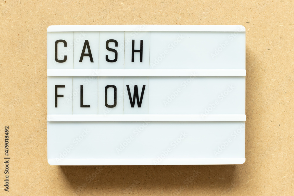 Canvas Prints Lightbox with word cash flow on wood background