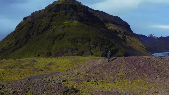 Aerial panoramic overlap around a man in black jacket and mount