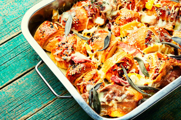 Croissant with baked ham baked with herbs.