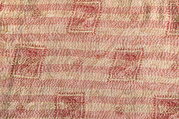 Close-up of kantha stitch recycled vintage silk fabric. Needlework technic of textile decoration,...