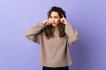 Fototapeta na wymiar Young caucasian woman isolated on purple background having doubts and thinking