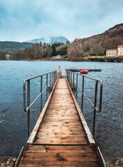 Naklejka premium View down a jetty toward a mountain - Scotland 