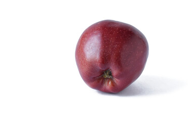 A fresh red apple is highlighted on white. With trajectory cropping. copy space