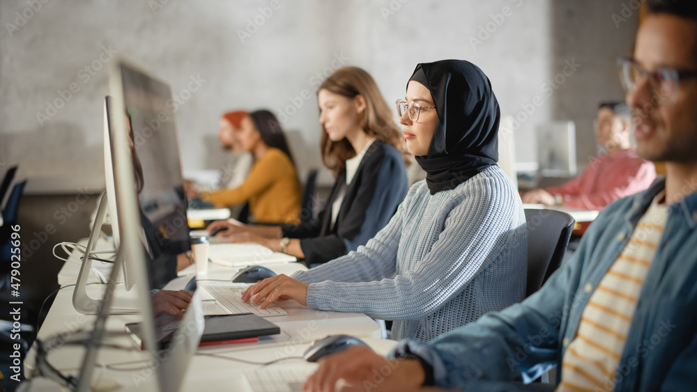 Aufkleber Diverse Multiethnic Group of Female and Male Students Sitting in College Room, Learning Computer Science. Young Scholars Study Information Technology on Computers in University, Writing Code in Class.