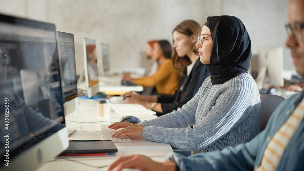 Aufkleber Diverse Multiethnic Group of Female and Male Students Sitting in College Room, Learning Computer Science. Young Scholars Study Information Technology on Computers in University, Writing Code in Class.