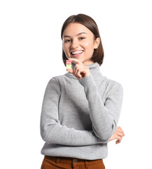 Young woman with chewing gum on white background
