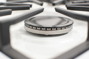 Close-up shoy of a rapid gas burner of a white gas hob