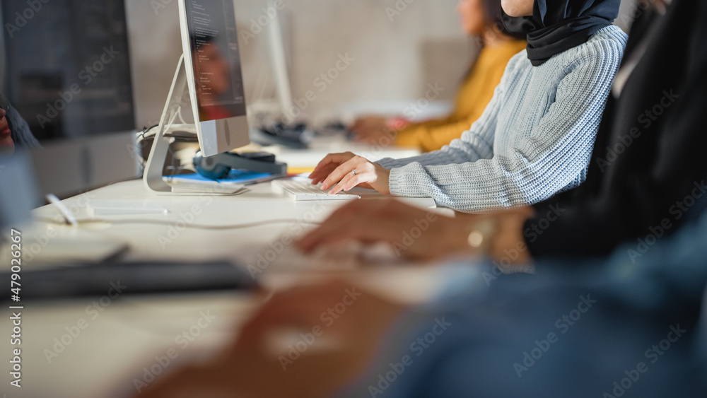 Aufkleber Close Up on Hands of Diverce Group of Students Sitting in College Room, Learning Computer Science. Young Scholars Study Information Technology on Computers in University, Writing Code in Class.