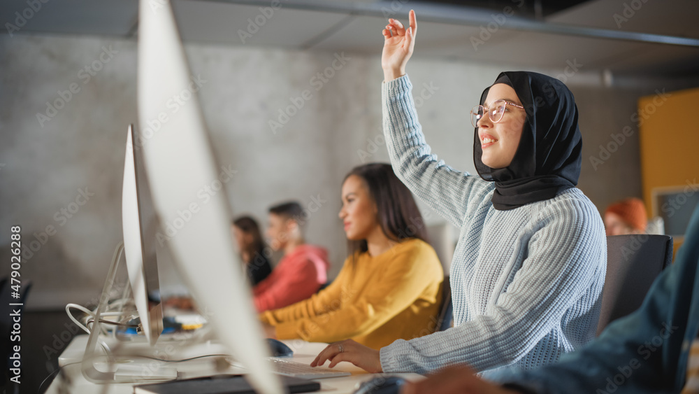 Aufkleber smart muslim female student in hijab studying in university with diverse multiethnic classmates. she