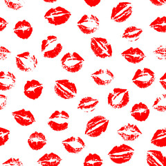 Vector seamless pattern of red kissing lips stamps randomly scattered on white background.