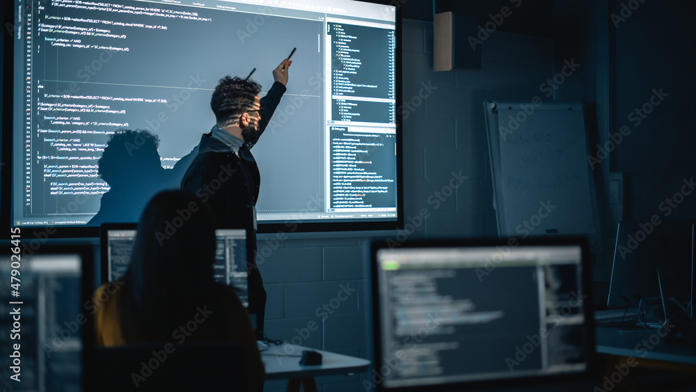 Aufkleber Teacher Giving Computer Science Lecture to Diverse Multiethnic Group of Female and Male Students in Dark College Room. Projecting Slideshow with Programming Code. Explaining Information Technology.