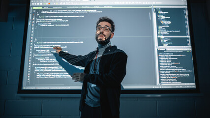 Teacher Giving Computer Science Lecture to Diverse Multiethnic Group of Female and Male Students in...