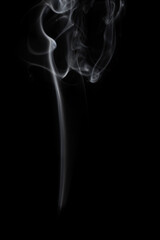 wax candle with burning wick and smoke, isolated on a black background