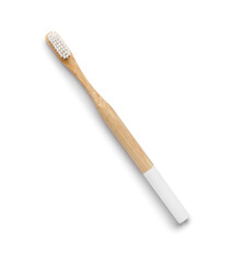 Bamboo toothbrush on white background